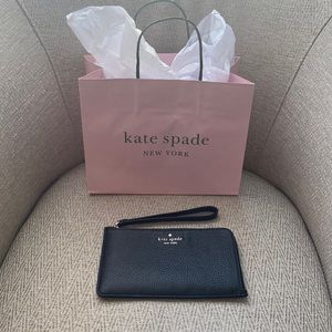 Kate Spade black leather wristlet. Lucy pebbled leather medi.